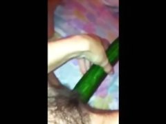Cucumber in tiny pussy